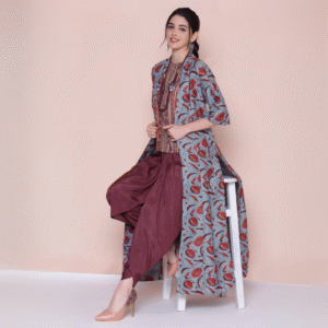 Woman wearing a stylish Turq & Metallic Poly 3-piece fusion set with printed kurta, maroon dhoti pants, and floral overlay jacket – Indo-western festive wear.